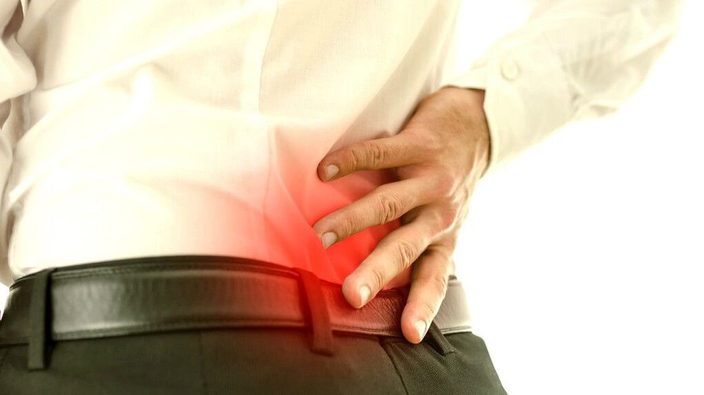 a man's lower back hurts